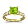 A yellow-gold princess-cut peridot ring.