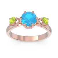 Swiss Blue Topaz Ring In 18K Rose Gold With Pink Tourmaline And Peridot Taraggana Round Three-stone Ring